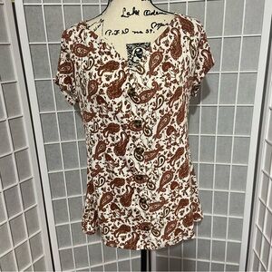 White Cap Sleeve Blouse with V-Neckline and Floral Print